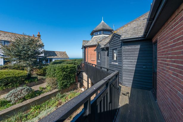 Idyllic Whitstable house for sale where garden is a beach with a pub on it
