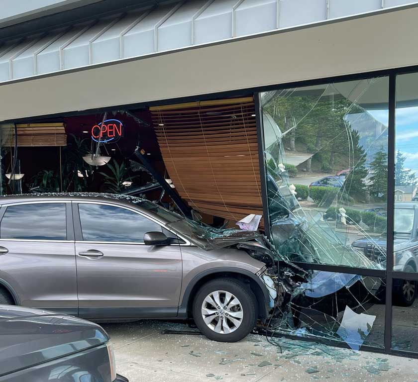 Two injured when car crashes into restaurant in Kent Friday